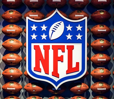nfl logo on background of footballs Image